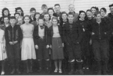 526: Group of 27 children. (circa 1950) [courtesy of Lorna Richardson] ** also see 527 **  Back-to-front, left-to-right,  Margie Norman (back), Beth Lambe (middle), Babe Ennis (front, white skirt);  Angela Ryan (back), Mary Finn (middle), Francis Barry (front);  Marie Ryan (back), Annie Norman (2nd from back, partially hidden), Madonna McCarthy (3rd  from back, blonde hair), Madonna Whelan (front, white skirt);  Gerard Lambe (back), Imelda Ryan (middle), Dave Ryan (front);  Paul McCarthy (back), Gwen Carroll (2nd from back), Noreen Ryan (3rd from back),  Mary Ennis (front); Camillus Dunphy (back), Teresa Whelan (middle, big smile),  Patrick Lambe (front); Mr. Denis Patrick Barry (back, schoolmaster), Marie Counsel, Kevin Ryan,  Betty Ennis (back), Thomas Barry (front), Adrian Ryan, Joseph Dunphy, Kevin Carroll.  - Francis Barry (of Thomas Barry &amp;amp; Catherine Corrigan)  - Thomas Barry (of Thomas Barry &amp;amp; Anne Dollimont)  - Gwen Carroll (of Michael Carroll &amp;amp; Josephine Barry)  - Kevin Carroll (of Michael Carroll &amp;amp; Josephine Barry)  - Marie Counsel (of Michael Counsel &amp;amp; Mary Anne Barry)  - Camillus Dunphy (of Thomas Dunphy &amp;amp; Anastasia Carroll)  - Joseph Dunphy (of Thomas Dunphy &amp;amp; Anastasia Carroll)  - Babe Ennis (of Vincent Ennis &amp;amp; Mary Carroll)  - Betty Ennis (of Vincent Ennis &amp;amp; Mary Carroll)  - Mary Ennis (of Vincent Ennis &amp;amp; Mary Carroll)  - Mary Finn (of Patrick Finn &amp;amp; Helena Hayward)  - Beth Lambe (of James Lambe &amp;amp; Catherine Rodgers)  - Gerard Lambe (of Peter Lambe &amp;amp; Anne Norman)  - Patrick Lambe (of Peter Lambe &amp;amp; Anne Norman)  - Madonna McCarthy (of James McCarthy &amp;amp; Mary Ellen Barry)  - Paul McCarthy (of Thomas McCarthy &amp;amp; Margaret Whelan)  - Annie Norman (of John Norman &amp;amp; Mary Farget)  - Margie Norman (of Charles Norman &amp;amp; Elizabeth Anne Barry)  - Adrian Ryan (of Albert Ryan &amp;amp; Catherine Nolan)  - Angela Ryan (of Michael Ryan &amp;amp; Petronella Whelan)  - David Ryan (of Jeremiah Ryan &amp;amp; Josephine Lambe)  - Imelda Ryan (of Jeremiah Ryan &amp;amp; Josephine Lambe)  - Kevin Ryan (of Albert Ryan &amp;amp; Catherine Nolan)  - Marie Ryan (of Joseph Ryan &amp;amp; Ursula Barry)  - Noreen Ryan (of Albert Ryan &amp;amp; Catherine Nolan)  - Madonna Whelan (of Leo Whelan &amp;amp; Elizabeth Bishop)  - Teresa Whelan (of Leo Whelan &amp;amp; Elizabeth Bishop)